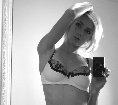 Blonde with perky boobs takes selfie with camera in white/black lace bra