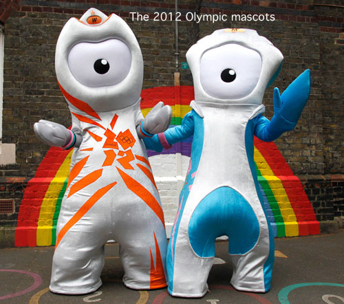 Two people pose in 2012 Olympic Mascots blue/white/orange costumes