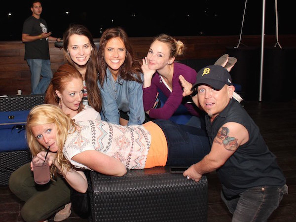 hot girls hanging out with a midget in a detroit baseball cap drinking alcohol