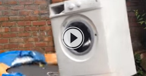 A brick inside a washing machine tied to a trampoline (Video)
