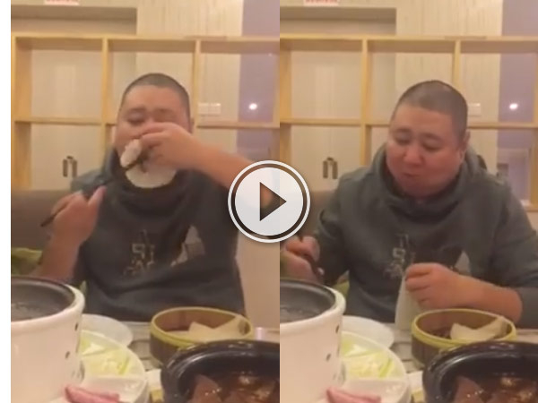 This guy has got the best way to eat Peking Duck ever.