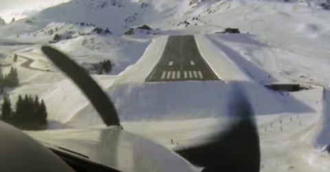 Someone clicks a picture of the snowy runway from the inside because of the wing visible in it.