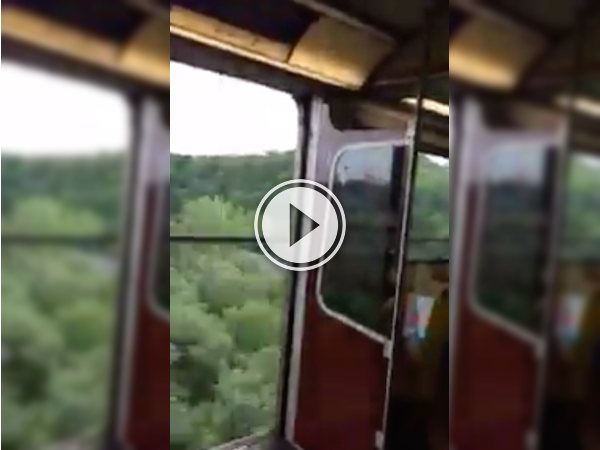 Toronto Subway car speeds across a bridge with the doors open! (Video)