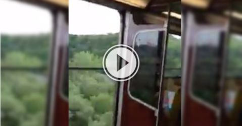 Toronto Subway car speeds across a bridge with the doors open! (Video)