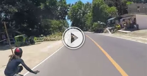 Longboarder just misses motorcyclist (Video)