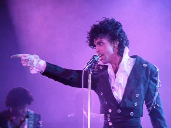 Amazing singer performing on the stage while singing.