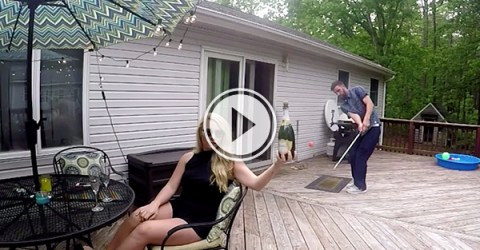 Video grab of a guy popping champagne with a golf ball