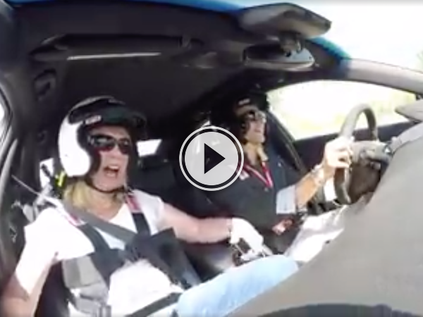 Screenshot of the video of a Reactions of a woman inside a racing car
