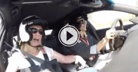 Screenshot of the video of a Reactions of a woman inside a racing car