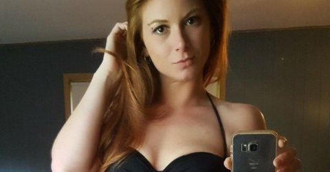 Hot chick taking selfie in a black bikini top