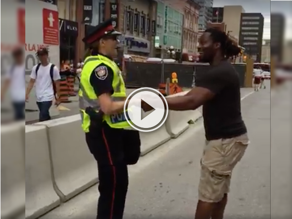 Ottawa officer and a pedestrian engage in a fun dance! (Video)