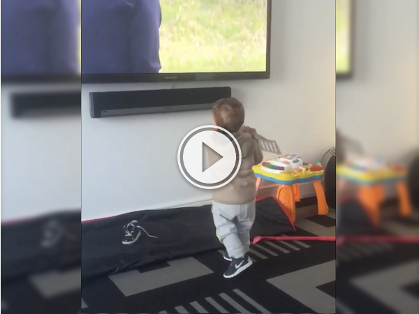This kid's so into golf, he'll practice with anything! (Video)