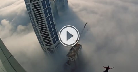 Base jumping through a fog of skyscrapers (Video)