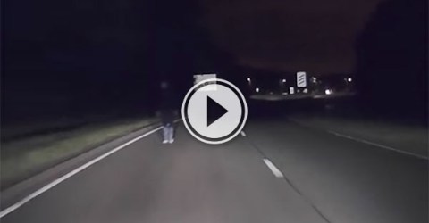 Driver narrowly misses drunk man on motorway (Video)