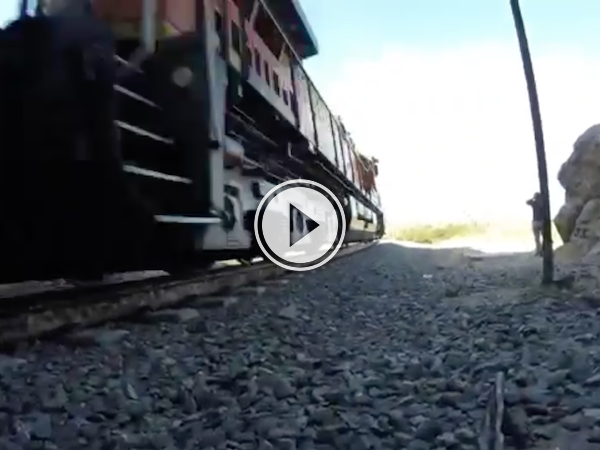 Dudes assume a train tunnel is abandoned. They're wrong! (Video)