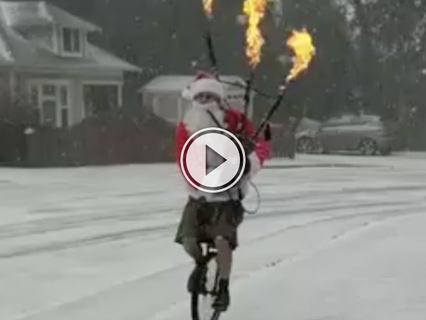 Santa riding a unicycle and playing a flaming bagpipe to the GOT theme