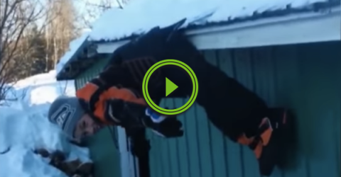 Kid falls off a snowy roof, but doesn't nail the landing (Video)