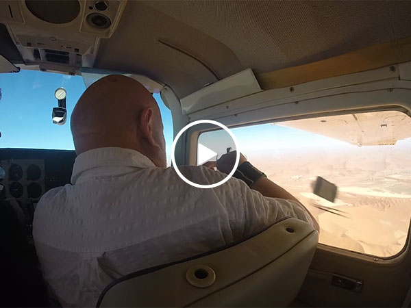 Guy gets his camera sucked out of airplane window (Video)