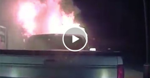 Hero police officer pushes burning truck away from building (Video)