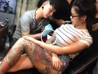 Cute Asian chick pulls a fake boob prank in tattoo parlor (Video)