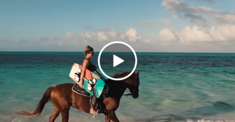 Horse pulling wakeboarder looks like Summer incarnate