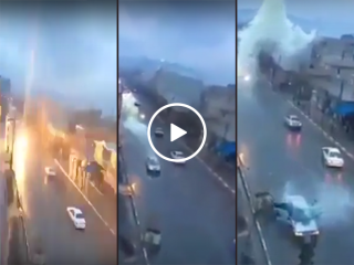 Lightning strikes a car as it drives down the road (Video)