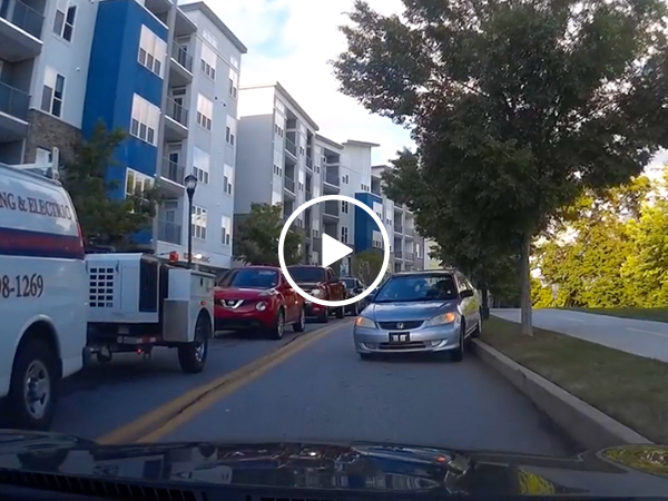 Idiot driver endures the longest 'reverse of shame' ever (Video)