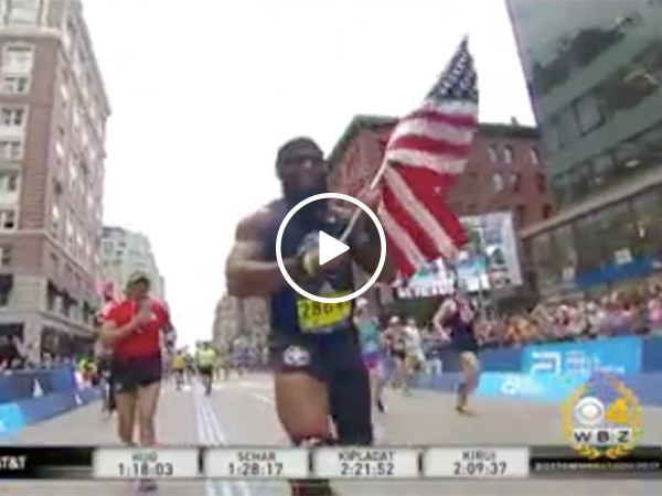 Amputee runs Boston Marathon with flag in hand