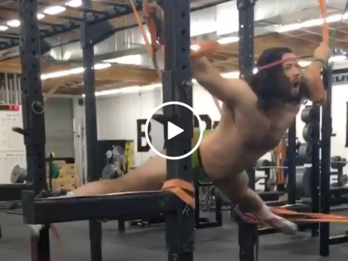 Guy strapped to elastic bands has a crazy new workout (Video)