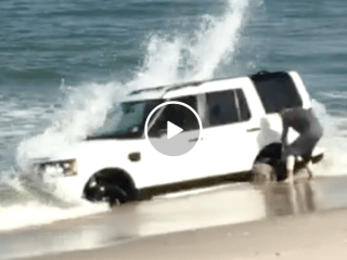 Kid gets Land Rover stuck in beach (Video)