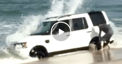 Kid gets Land Rover stuck in beach (Video)