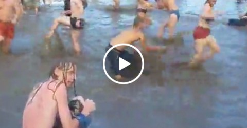 Guy emerges from festival water for his... precious (Video)