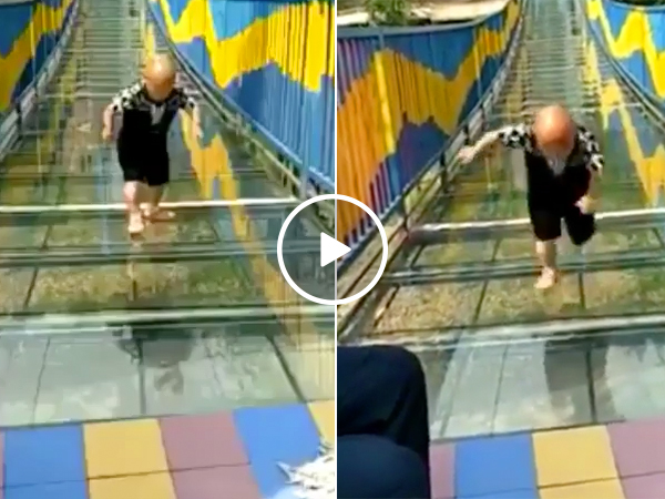 Guy needing traction vs. a glass bridge (Video)