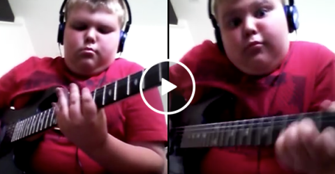 Little boy plays badass original riff on his guitar (Video)