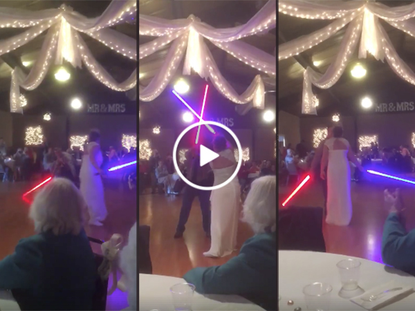 Couple has lightsaber fight for first dance