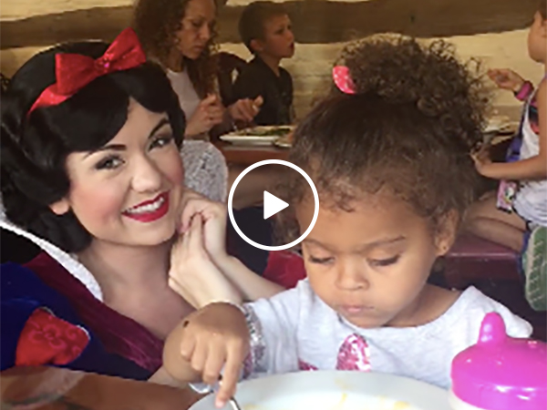 Little girl ignores Snow White