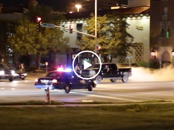 Truck does sick burn out in front of cop (Video)