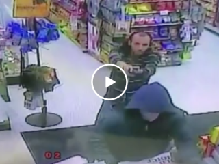 Armed robber finds out he's not the only one with a gun (Video)