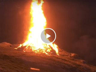Bonfire explodes without warning (Video)
