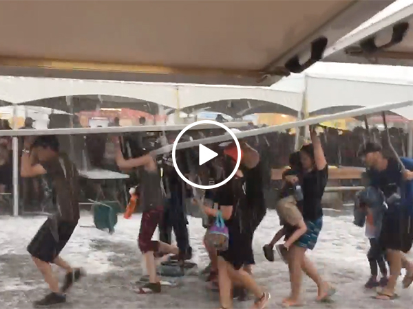 Hail storm causes people to run