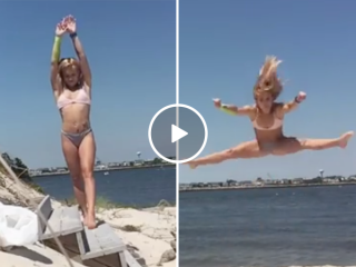 Beautiful woman does impressive flips at the beach (Video)