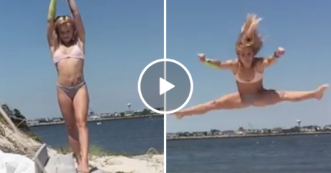 Beautiful woman does impressive flips at the beach (Video)
