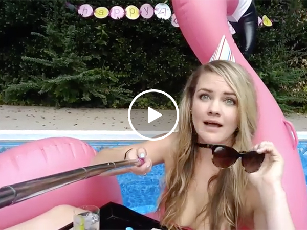 Girl falls into pool while taking a selfie