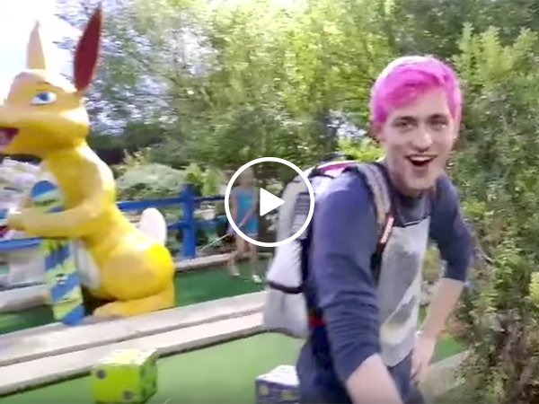 Girl owns man playing mini golf