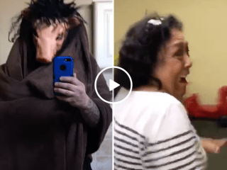 Woman has hilarious reaction to man in pig mask (Video)