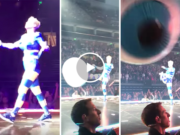 Katy Perry kicks ball into camera at her concert while singing Roar