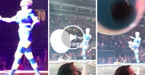 Katy Perry kicks ball into camera at her concert while singing Roar