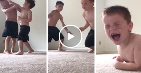 Two young brothers have a fight in slow motion