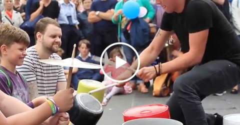 Street performer puts on amazing drum solo using buckets (Video)