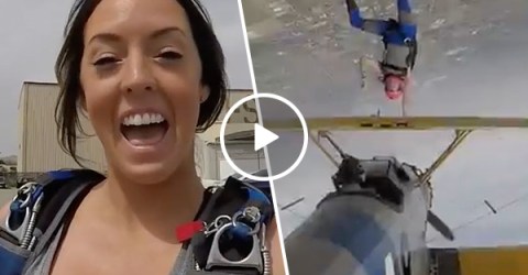 Woman performs bad ass upside-down biplane skydive (Video)